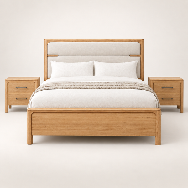 A modern wooden bed frame with a padded headboard, shown with white bedding and two matching wood nightstands against a clean off-white studio background.