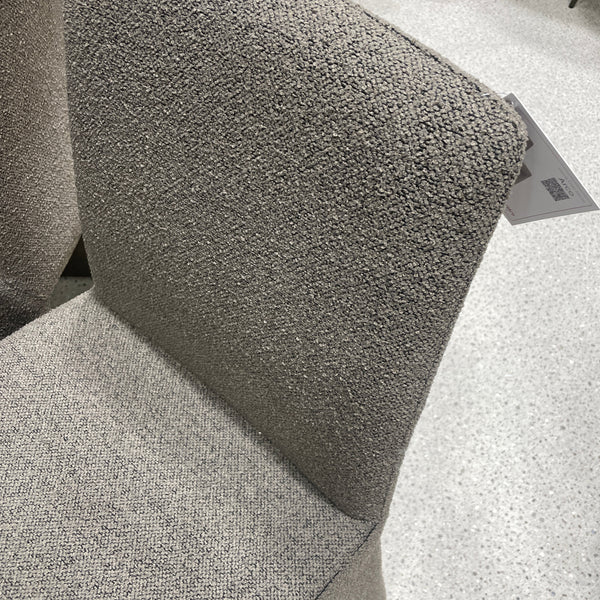 Arco dining chair with speckled gray tweed upholstery, curved backrest and seat