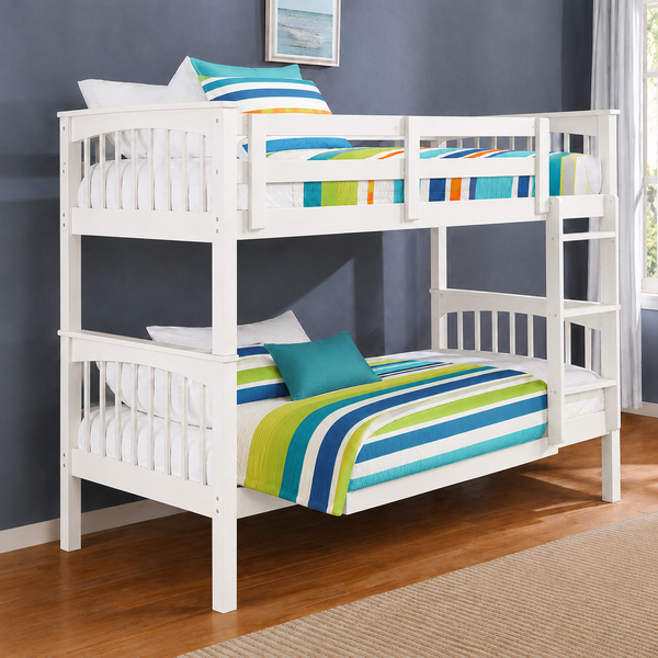 White wooden bunk bed with colorful striped bedding in a bedroom setting with a dark blue wall and wood floor.
