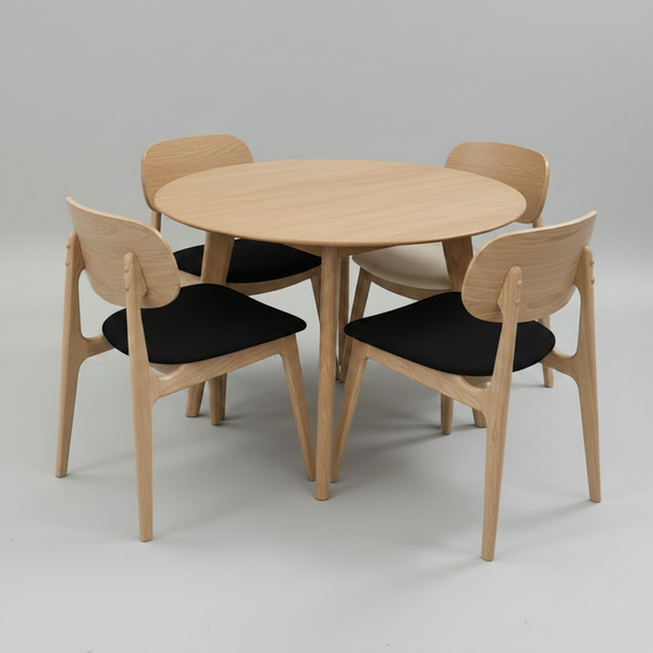 Dining set with round table and four chairs on a gray background