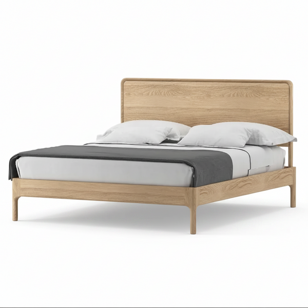 A modern wooden bed frame with a light oak finish, styled with white bedding and a dark gray throw blanket, shown against a plain white background.