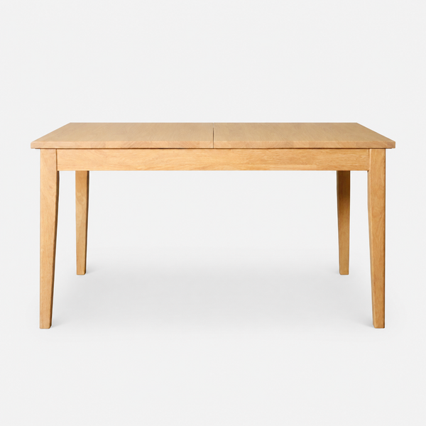 A light natural wood extendable dining table with four legs, shown from a front three-quarter angle against a plain white background.