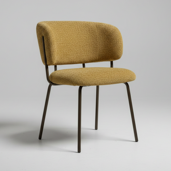 A modern dining chair with a textured mustard yellow bouclé upholstered seat and curved backrest, supported by slim dark metal legs, shown against a neutral light gray background.
