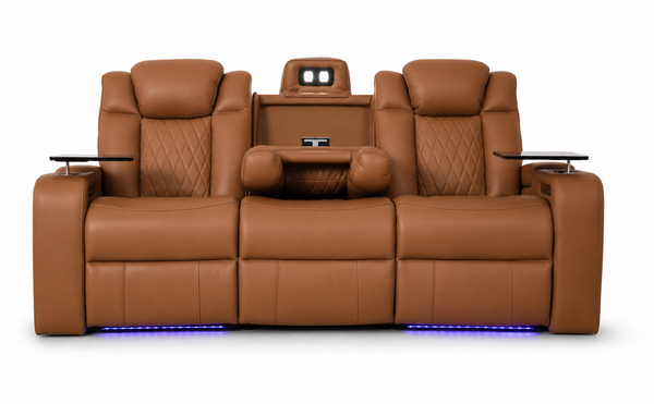 A luxury three-seat home theater recliner sofa in tan leather, featuring quilted backrests, integrated headrests, side tables with screens, and blue LED underglow, shown against a solid white background.