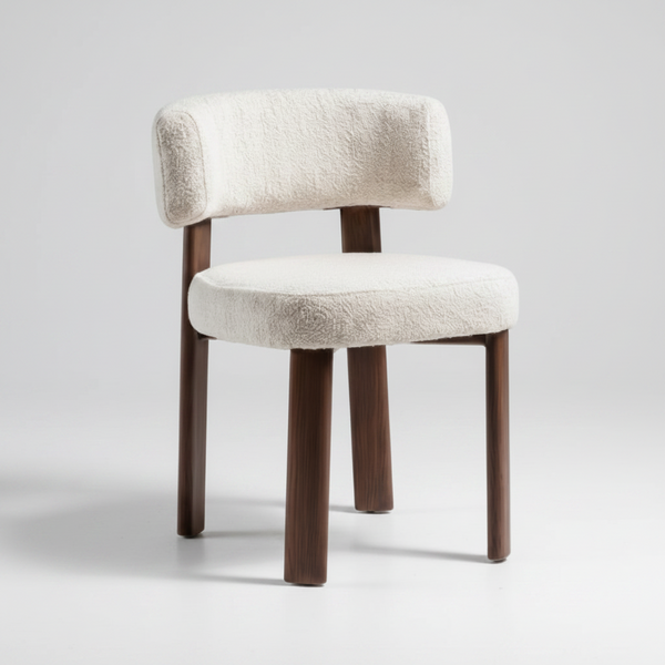 Light grey upholstered dining chair with rounded back, dark walnut legs and seat