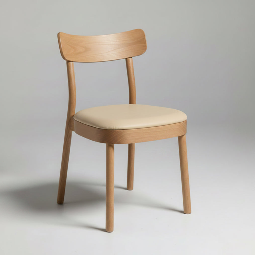 A wooden dining chair with a curved backrest and a black upholstered seat cushion