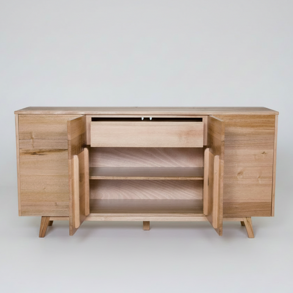A light natural wood sideboard cabinet with two doors open to show the interior shelving and drawer, photographed against a solid white background.