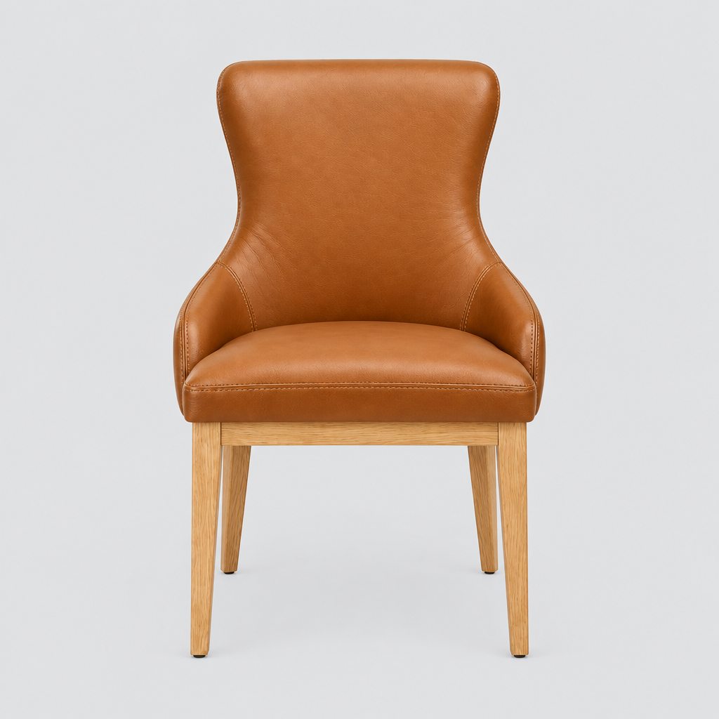 A modern accent chair with a warm caramel brown leather upholstered seat and backrest, supported by a light natural wood frame with tapered legs, shown against a solid light gray background.
